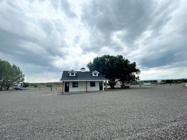 The Front of a House in White and Navy Blue Roof